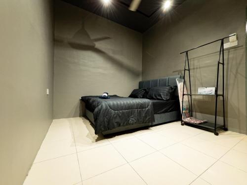 a bedroom with a bed with a shark projected on the wall at NDD Homestay in Sitiawan