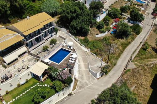 an overhead view of a house with a swimming pool at Spyridoula Studio 12 in Paleokastritsa