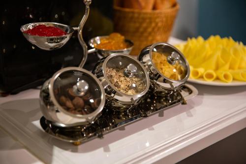 a tray of different types of food on a table at Hanoi Fiesta Central Hotel and Spa in Hanoi