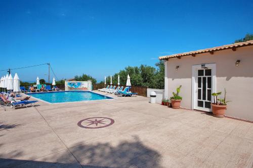 a villa with a swimming pool in a resort at Zante View Family Studio 2 in Tsilivi