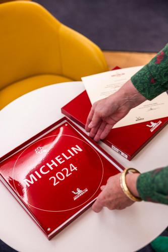 a person reaching for a box on a table at Small Luxury Hotel Goldgasse in Salzburg