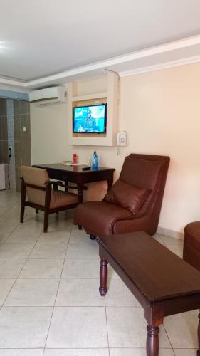 TV a/nebo společenská místnost v ubytování Savannah Paradise Hotel