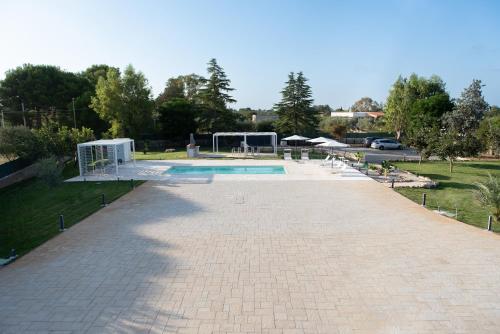 a swimming pool with a goal in a park at CHIALE Holiday Villa in Polignano a Mare
