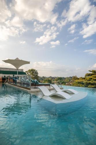 a rendering of a swimming pool with blue water at Gem Forest Hotel Nairobi - MGallery Collection in Nairobi