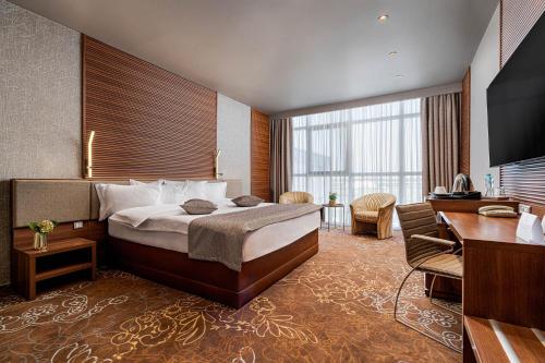 Postel nebo postele na pokoji v ubytování RIN Airport Hotel
