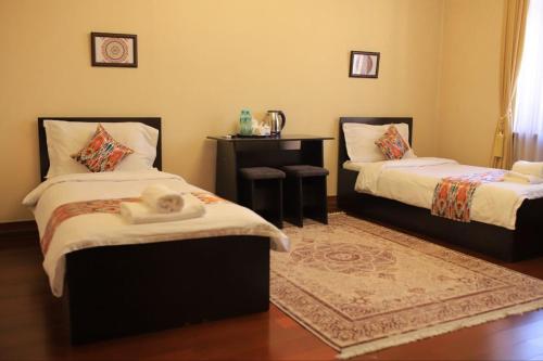 Ένα ή περισσότερα κρεβάτια σε δωμάτιο στο CITY GARDEN HOTEL