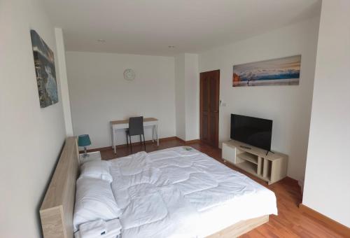 Postel nebo postele na pokoji v ubytování DreamStay
