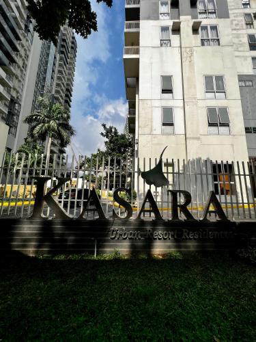 a sign in front of a building at Kasara Serenity Condotel in Manila