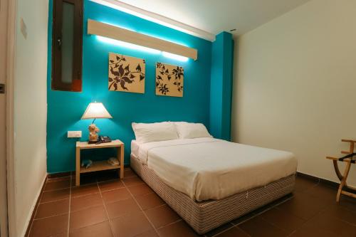 Postel nebo postele na pokoji v ubytování Fomecs Boutique Hotel, Jonker Street