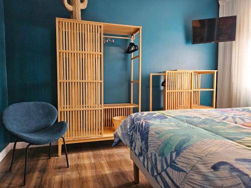 En eller flere senge i et værelse på Le loft bleu 16 couchages classé 3 étoiles