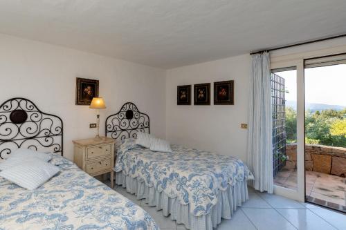 Postel nebo postele na pokoji v ubytování Villa Ippocampo by Wonderful Italy