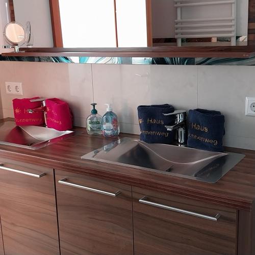 a kitchen counter with a sink in a kitchen at Haus Sonnenweg in Mariapfarr
