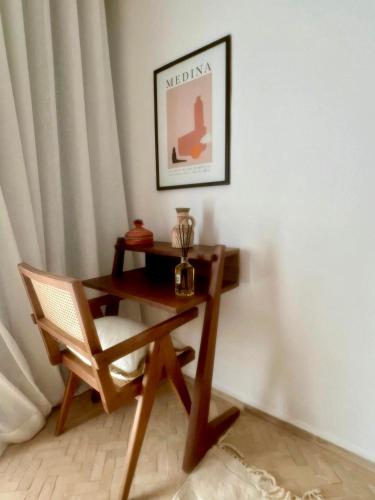 a desk and a chair in a room at Villa Madjha Ecolodge Marrakech in Marrakech