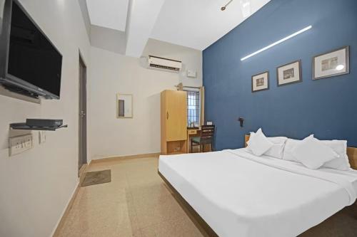 Hotel Sadha Siva Near Chennai Airportにあるベッド