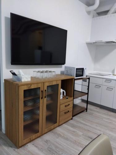 Η κουζίνα ή μικρή κουζίνα στο 肴町街舎