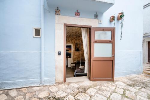 an open door of a white house at Suite Dolce Vita in Casamassima