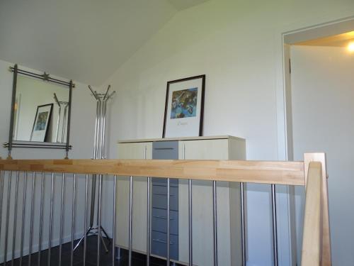 a room with a table and a mirror and a counter at Sunny Side Apartments in Postmünster