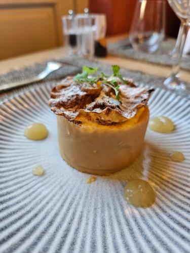 a dessert on a plate on a table at Logis Hôtel Restaurant Relais de la Mothe in Yzeures-sur-Creuse