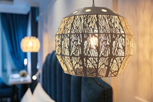a black and white lamp in a room at Hanoi Fiesta Central Hotel and Spa in Hanoi
