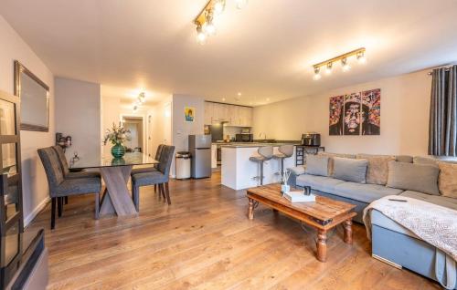 a living room with a couch and a table at Modern apartment in the city centre in Southampton