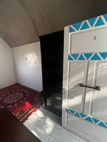 an open door in a room with a red carpet at Nile View Guest House in Aswan