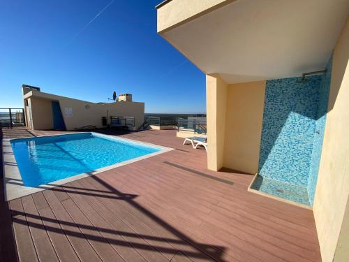 a swimming pool on the deck of a house at Am Hafen - House Barbara 1 l Marina Olhão in Olhão