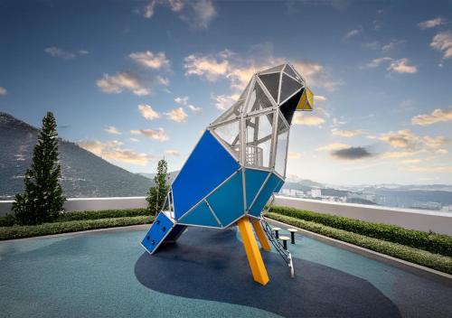a sculpture of a spaceship sitting on the ground at Iconic Regency Service Residences, managed by Iconic Hotel in Bayan Lepas