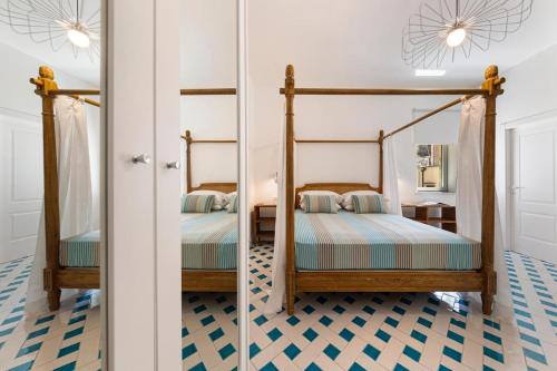 Ένα ή περισσότερα κρεβάτια σε δωμάτιο στο Maison Marika