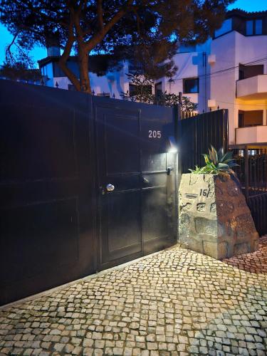 a black gate with the number on it at 205 Serenity in Cascais