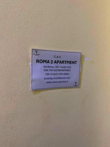 a sign on a wall that says can roma apartment at Roma 2 Apartment - THE V Collection in Turate