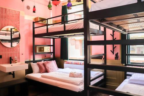 a room with a bunk bed and a sink at Hostel ROOM Rotterdam in Rotterdam