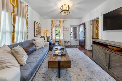 a living room with a couch and a coffee table at Cozy, Quiet 3BR Sugar House Hideaway by Mountains, Wi-Fi & Parking in Salt Lake City