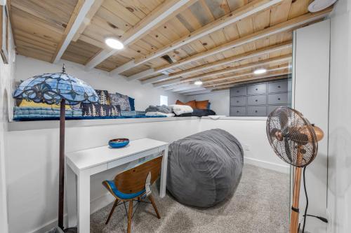 a room with a desk and a fan at Cozy, Quiet 3BR Sugar House Hideaway by Mountains, Wi-Fi & Parking in Salt Lake City