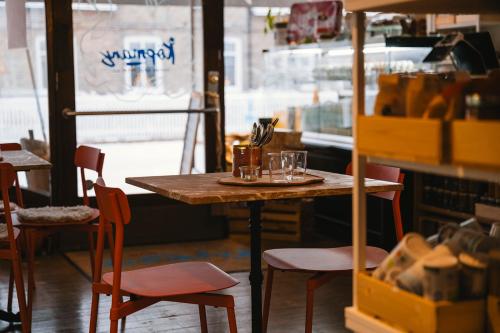 a table with glasses on it in a restaurant at Köpmans Boutique Hotel & Bistro in Höganäs