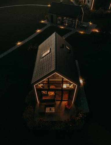 an overhead view of a house at night with lights at Szopa in Ustrzyki Dolne