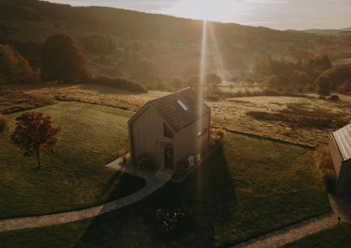 an aerial view of a small building in a field at Szopa in Ustrzyki Dolne