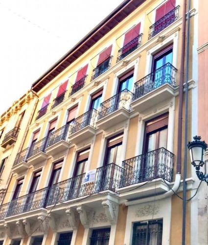 a building with balconies on the side of it at LovelyLoft Castaños in Alicante