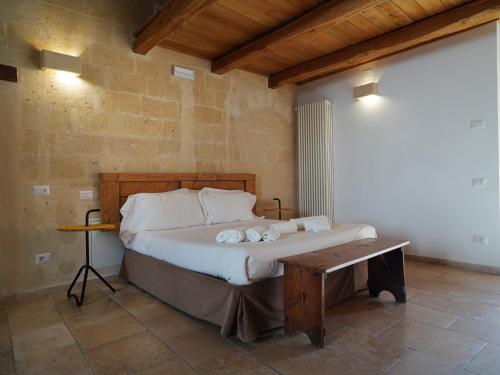a bedroom with a bed with towels on it at Due forni affittacamere in Matera