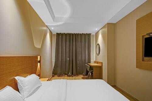 Katil atau katil-katil dalam bilik di Capital O Penthouse