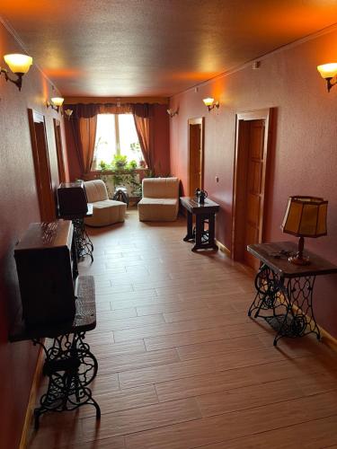 a living room with a couch and a tv at Hotel Karin in Budapest