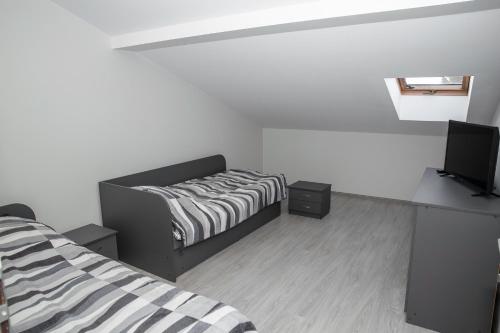 Ένα ή περισσότερα κρεβάτια σε δωμάτιο στο Guest house Mažeikiai