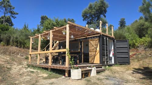 a house being built in a field at Alcmaria studio with amazing views! in Folhadosa