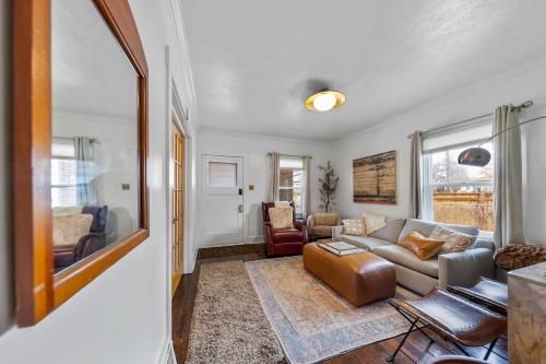 a living room with a couch and a table at Urban Escape by Mountains w/3BR, Wi-Fi, Laundry in Salt Lake City