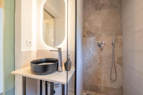 a bathroom with a sink and a shower at Casa Tuna - Beach 100m - Cala Llombards in Santanyi