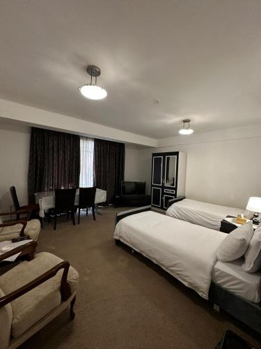 Ένα ή περισσότερα κρεβάτια σε δωμάτιο στο شقق و مطعم قرطاج