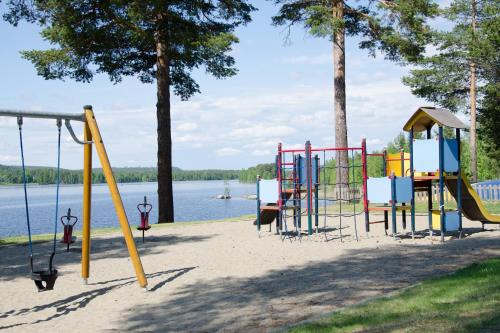 a playground next to a body of water at First Camp Ansia - Lycksele in Lycksele