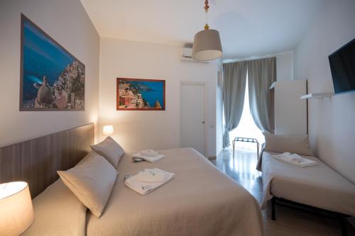 Letto o letti in una camera di Panoramic Rooms Salerno