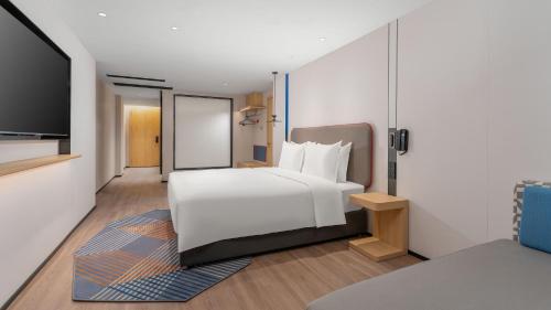 Ένα ή περισσότερα κρεβάτια σε δωμάτιο στο Holiday Inn Express Longyan Liancheng by IHG