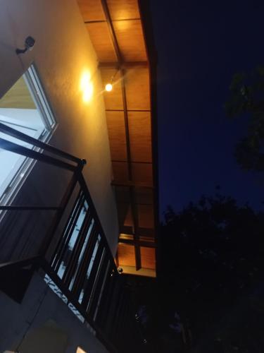 a stairway leading up to a building at night at Cinnamon garden villa in Weligama