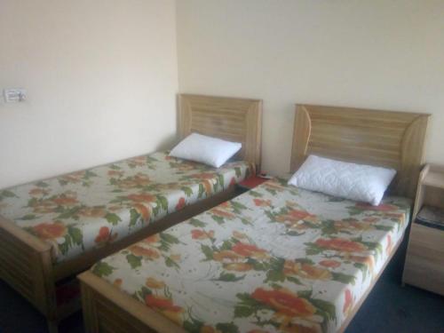 Postel nebo postele na pokoji v ubytování Royal Cottages